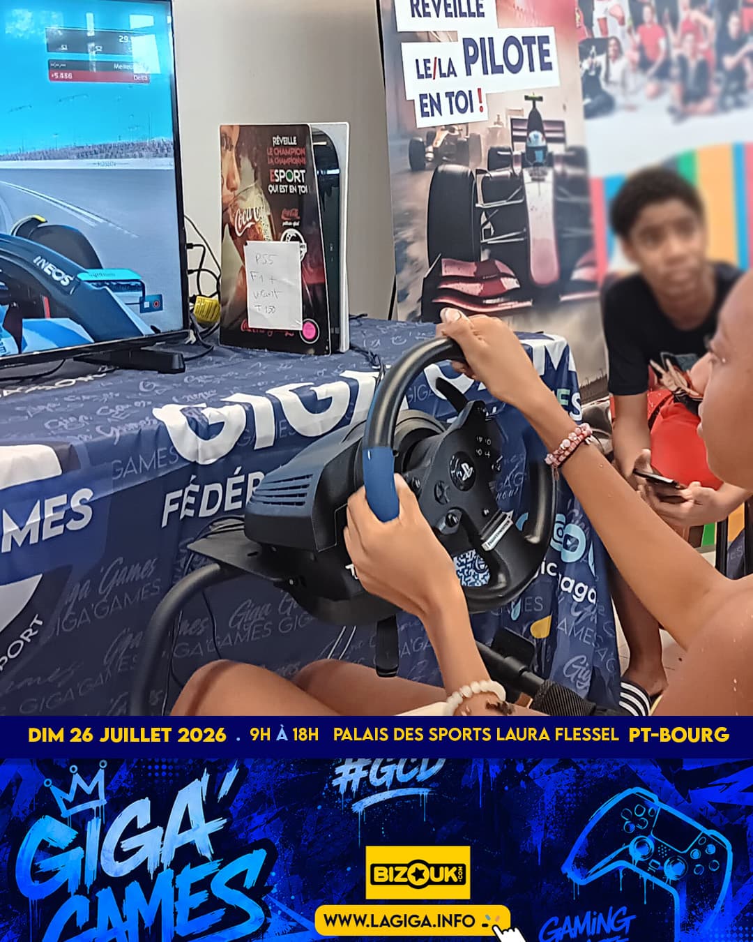 Young driver at the wheel of a racing simulator
