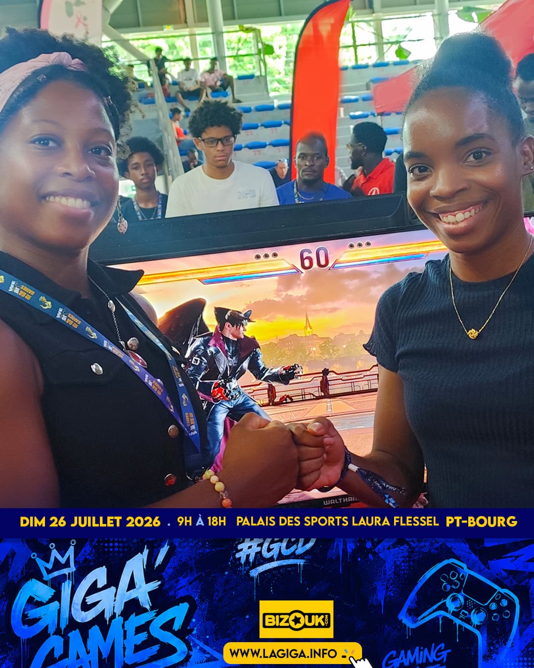 Two players fist-bumping in front of a Tekken 8 screen